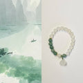 The lotus begets all creation �?White jade bracelet