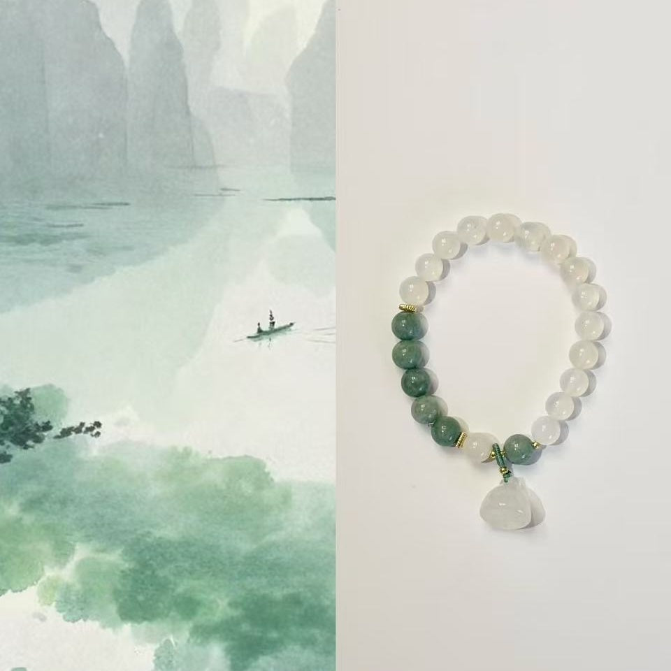 The lotus begets all creation �?White jade bracelet