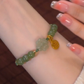 Lucky flower ? Emerald Jade stone braided cord bracelet