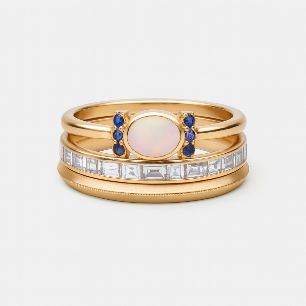 Tereza – A delicate gold ring with a radiant opal and clear contours.