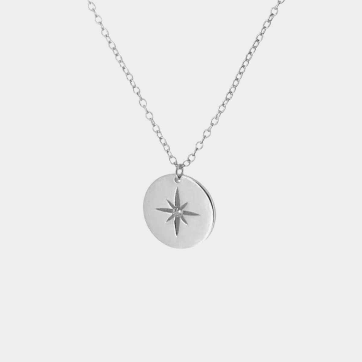 Sophie – A silver necklace with multiple layers and a modest pendant shape.