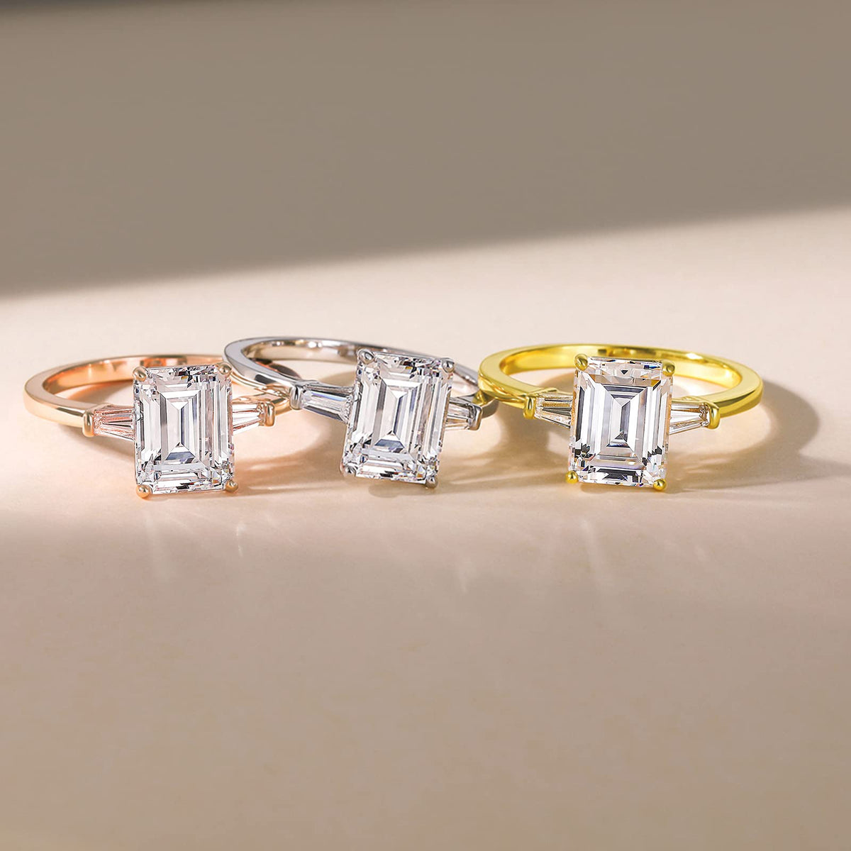 Emerald-cut three-stone ring