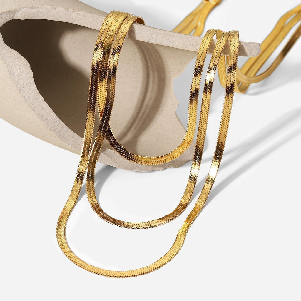 Sophie – A delicate gold necklace with multiple layers.