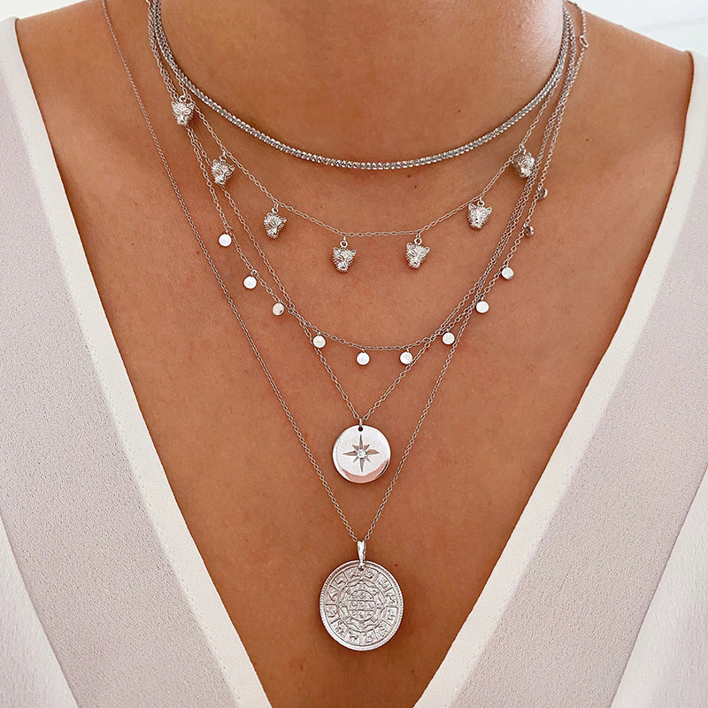 Sophie – A silver necklace with multiple layers and a modest pendant shape.