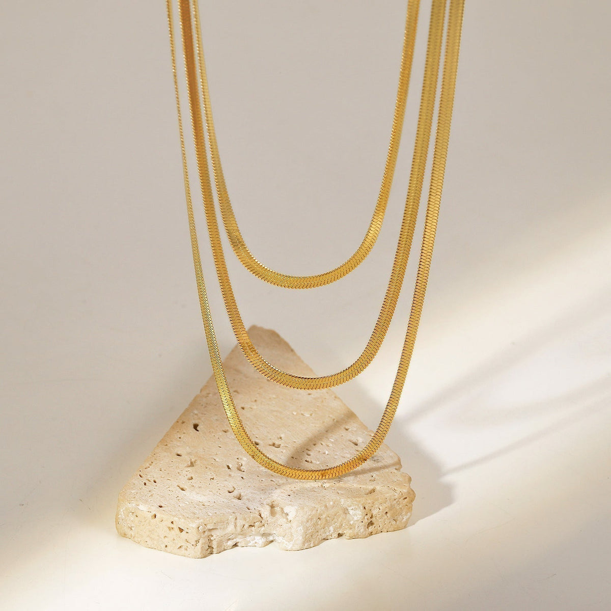 Sophie – A delicate gold necklace with multiple layers.
