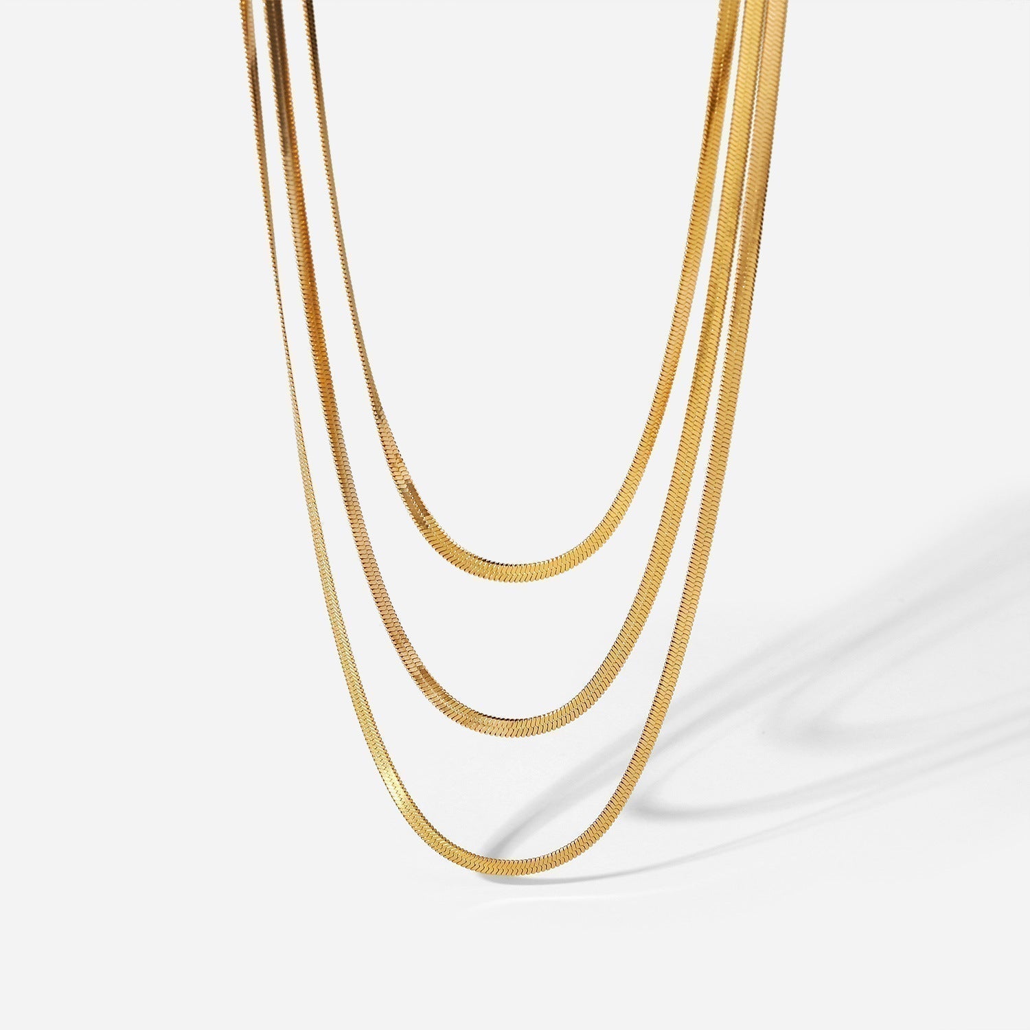 Sophie – A delicate gold necklace with multiple layers.