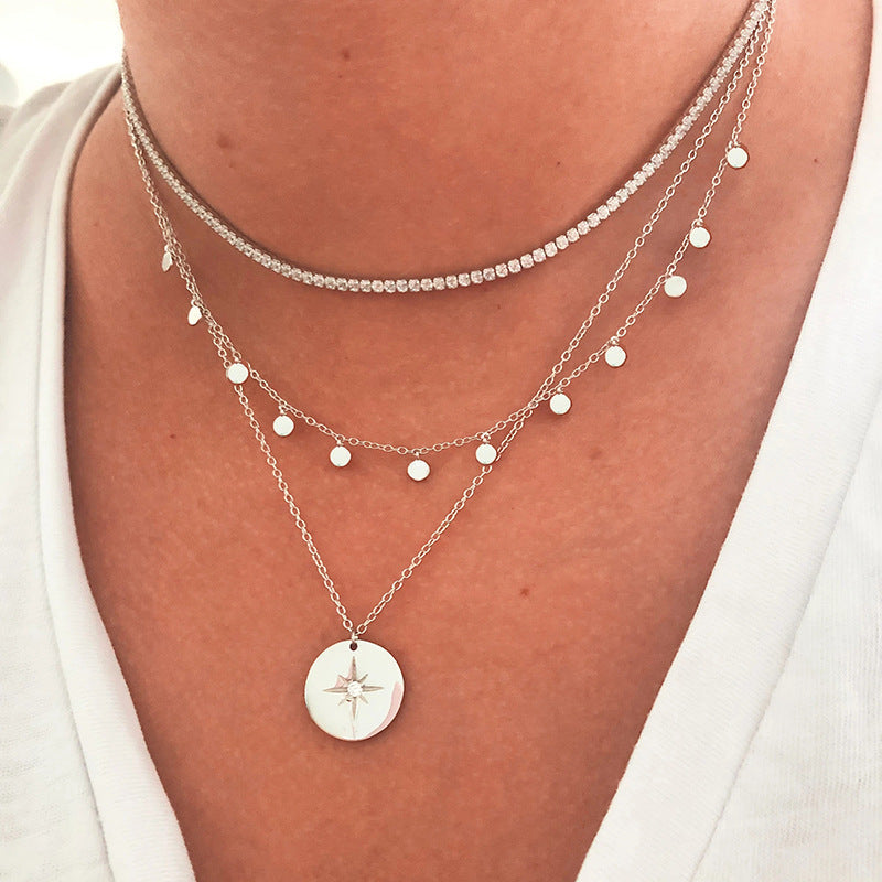 Sophie – A silver necklace with multiple layers and a modest pendant shape.