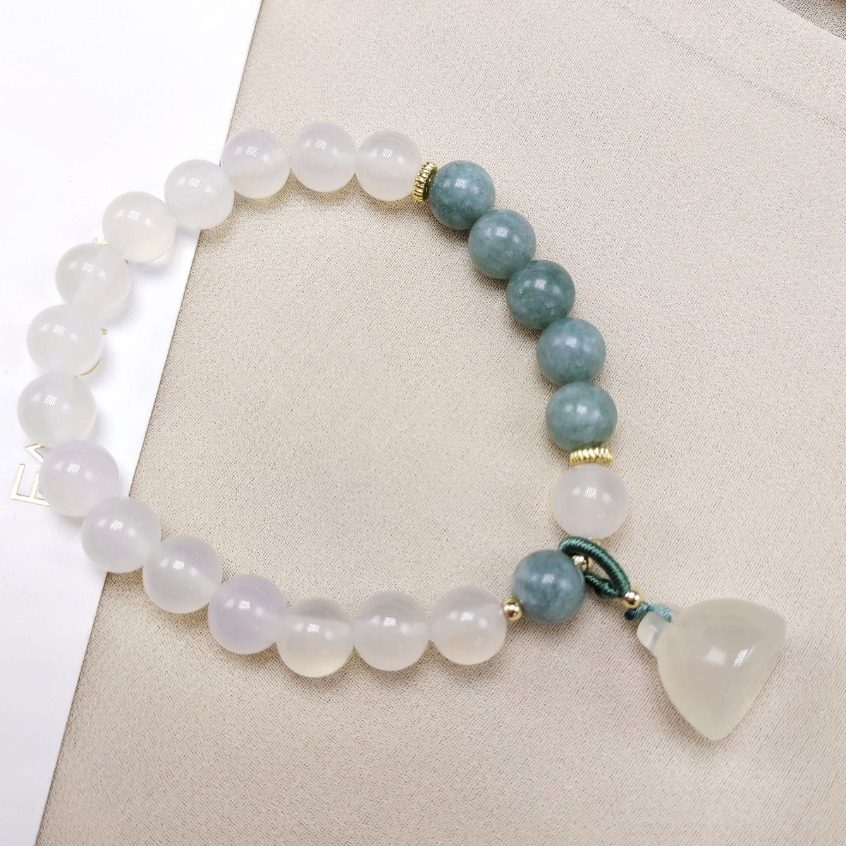 The lotus begets all creation �?White jade bracelet