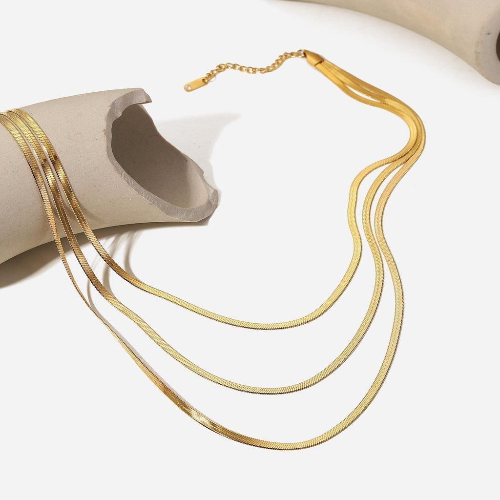 Sophie – A delicate gold necklace with multiple layers.