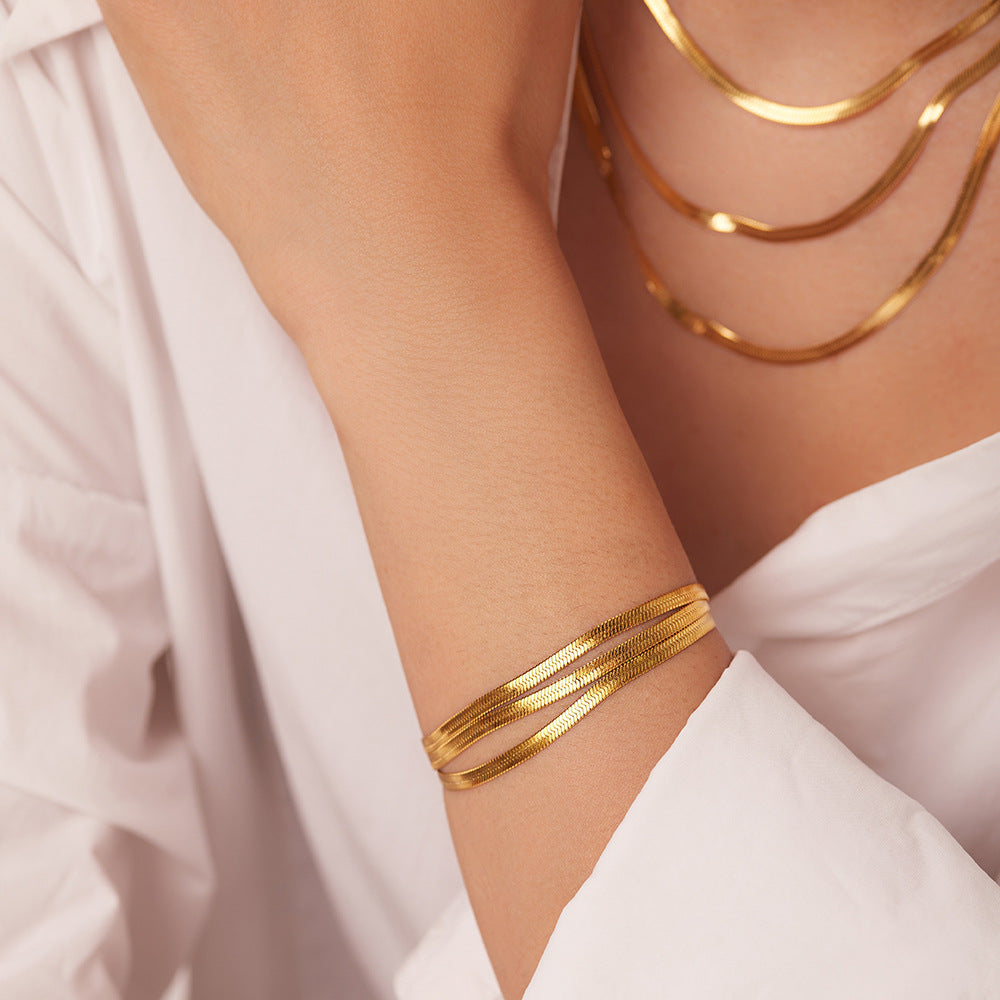 Sophie – A delicate gold necklace with multiple layers.
