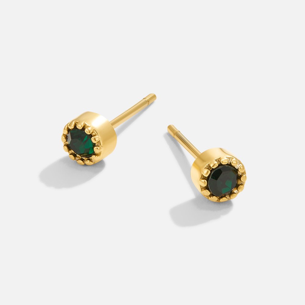 Victoria – Gold earrings adorned with green stones.