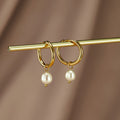 Elisa Marie – Pearl-Studded Earrings.